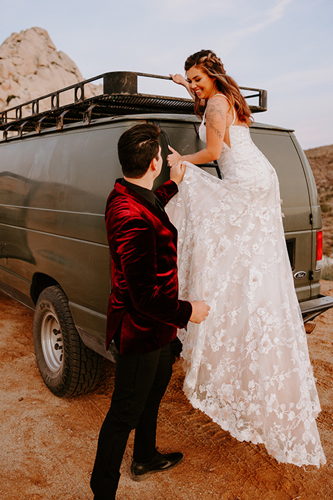  boho burgundy and beige wedding in the dessert – couple on their van 