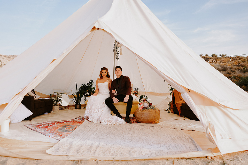  boho burgundy and beige wedding in the dessert – couple in the tent 