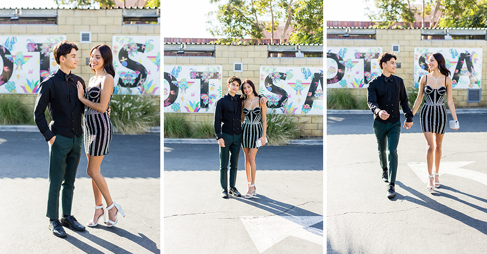  couple in all black suits walking to homecoming 