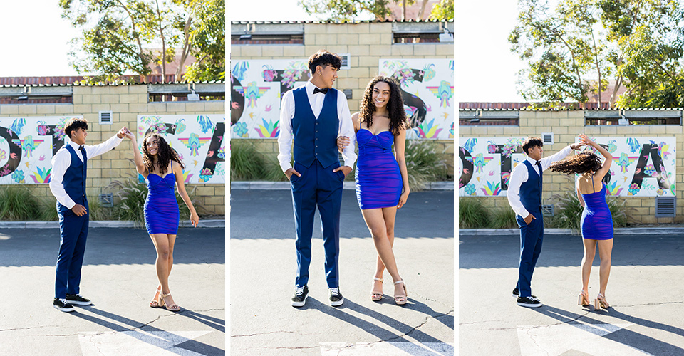  couple in all blue suits walking to homecoming 