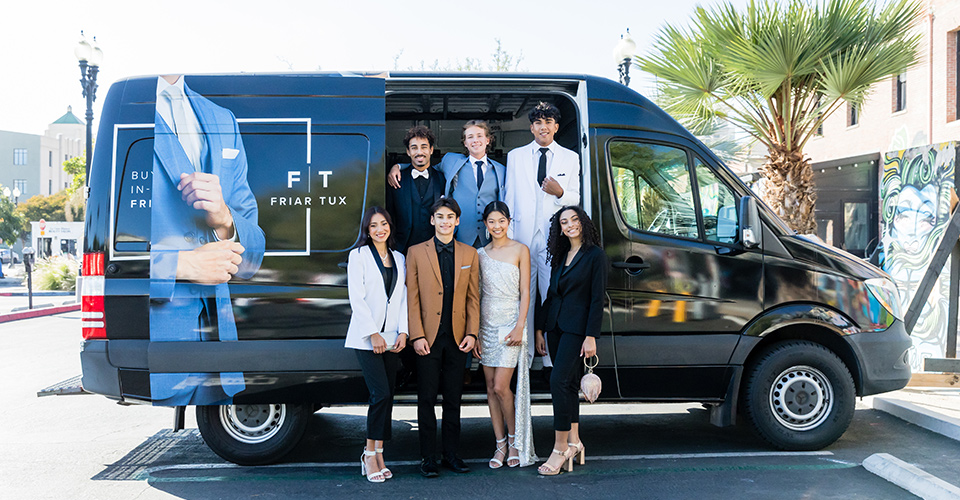  friends going to the homecoming dance in a Friar Tux van 