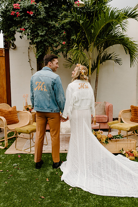  retro boho wedding with amber and brown color scheme – couple with jackets 