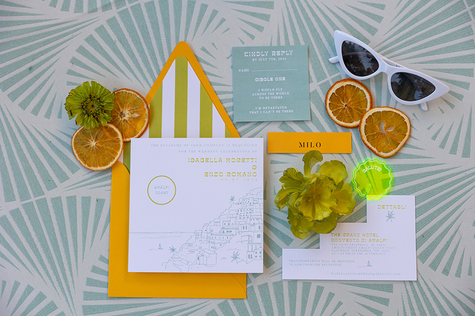  a colorful wedding inspired by the Amalfi Coast with the groom in different wedding day looks – invitations 