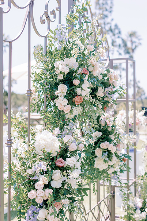  a Bridgerton inspired wedding with grand florals and dainty details - ceremony décor 