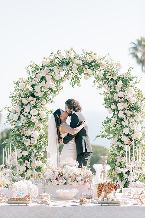  a Bridgerton inspired wedding with grand florals and dainty details - ceremony 