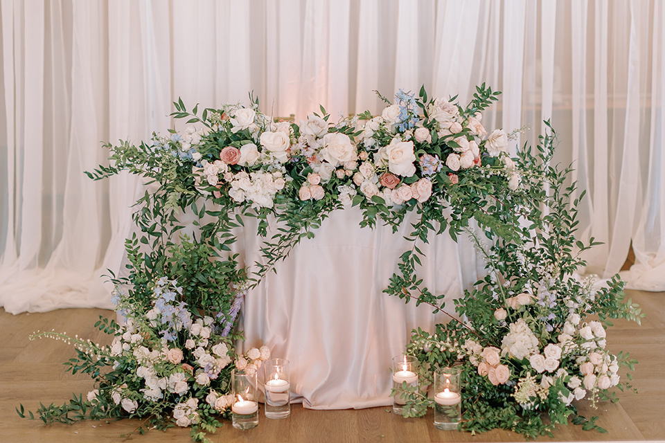  a Bridgerton inspired wedding with grand florals and dainty details – sweetheart table 