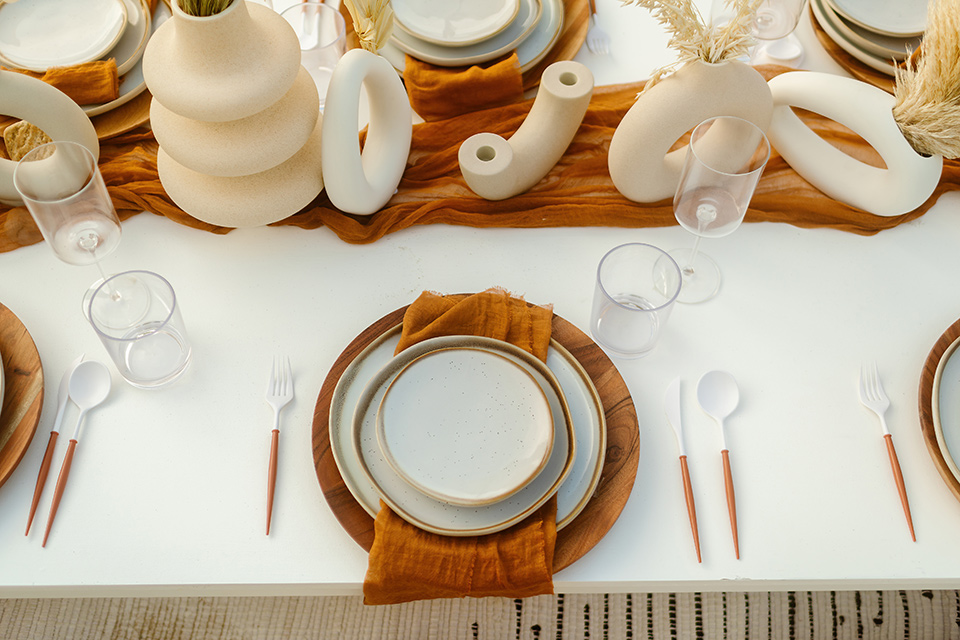  a neutral beachy elopement with the groom in a tan suit and the bride in a white lace dress – flatware 