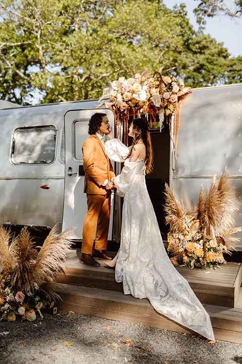  a boho caramel wedding inspo with an airstream and pampas grass – ceremony 