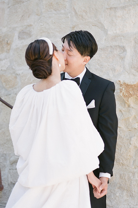  a European romantic wedding with an old world ethereal vibe – couple kissing