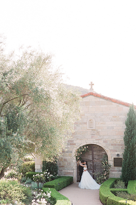  a European romantic wedding with an old world ethereal vibe – couple walking holding hands 