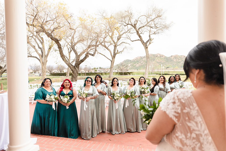 a romantic garden-rustic wedding with black and neutral décor elements and brick venue – bridesmaids in green dresses 