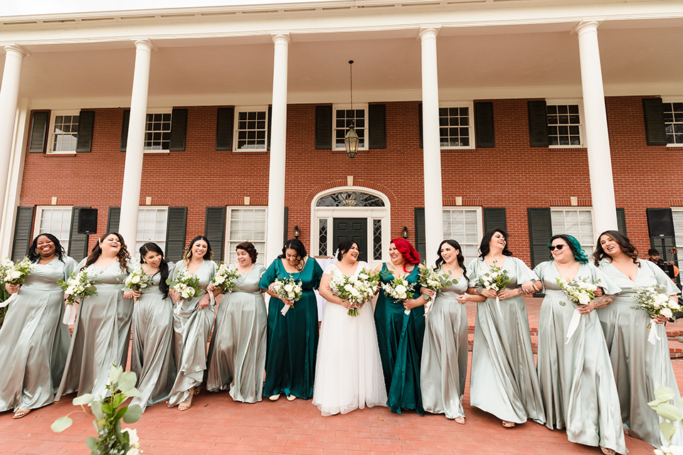  a romantic garden-rustic wedding with black and neutral décor elements and brick venue – bridesmaids in green dresses 