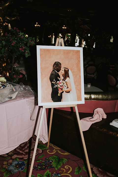  a grand pink and rose las vegas style wedding with bold trendy details – wedding signage and cake 