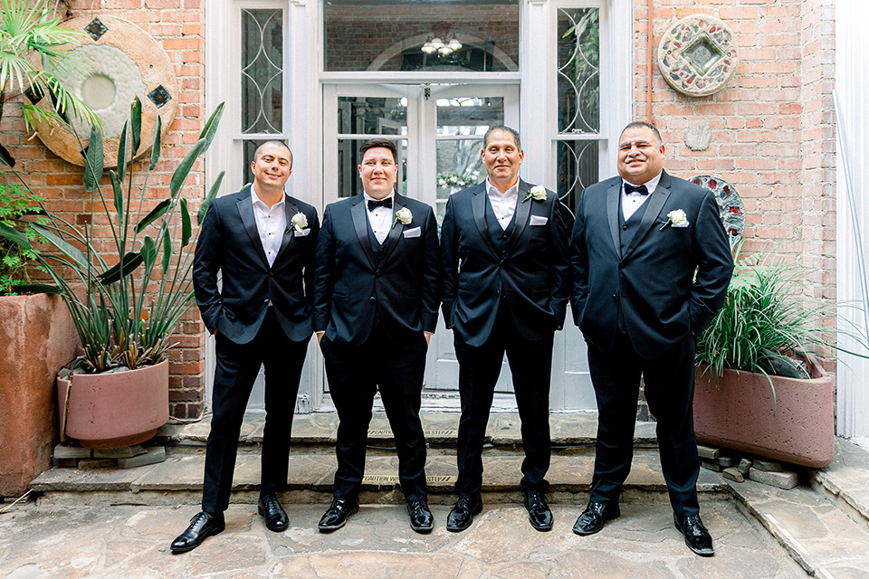  a classic blush and black wedding in a church - groomsmen 