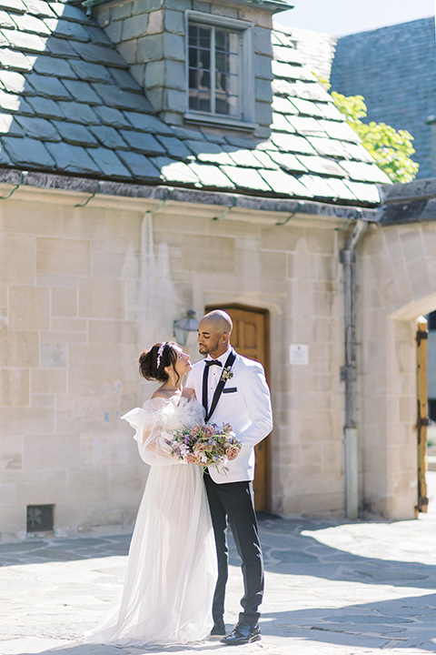  luxury wedding at Greystone Mansion with a classic design scheme - couple walking around the mansion 