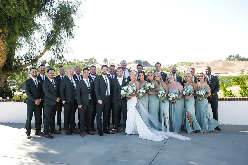  a green toned wedding with an outdoor venue - wedding party 