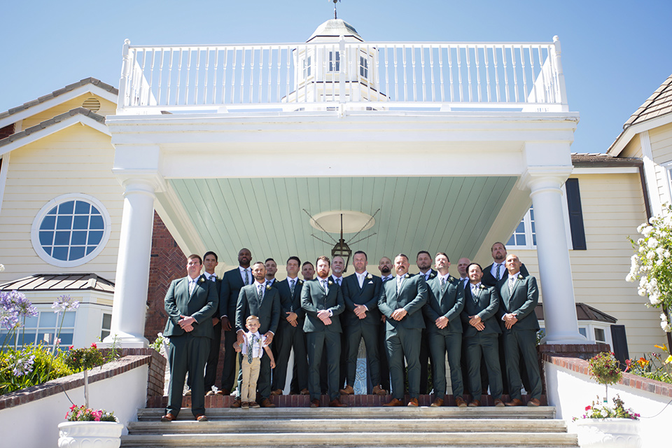  a green toned wedding with an outdoor venue - groomsmen 