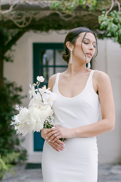  a monochromatic modern wedding at La Venta Inn with the bride in a sleek gown and the groom in a white tuxedo - bride 
