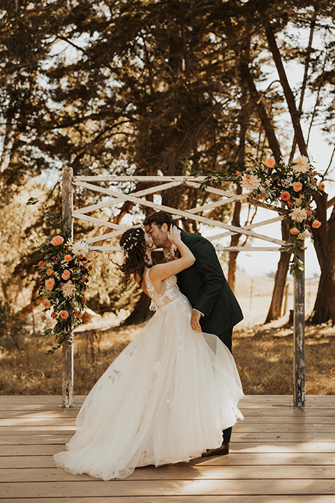  green and orange wedding in the woods with a rustic bohemian vibe – vows and first kiss 