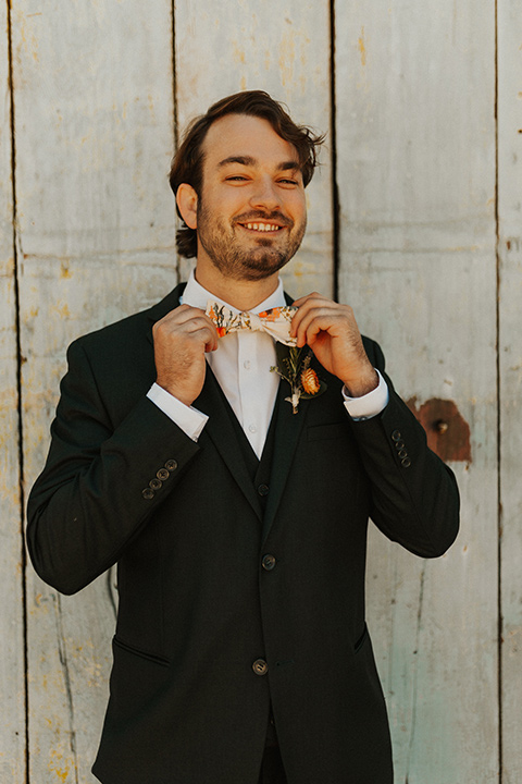  green and orange wedding in the woods with a rustic bohemian vibe – groom 