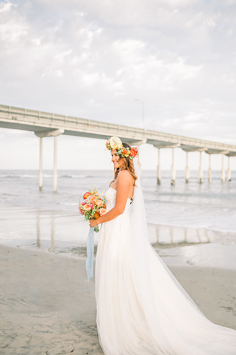  couple eloping on the beach with bright vibrant colors - bride 