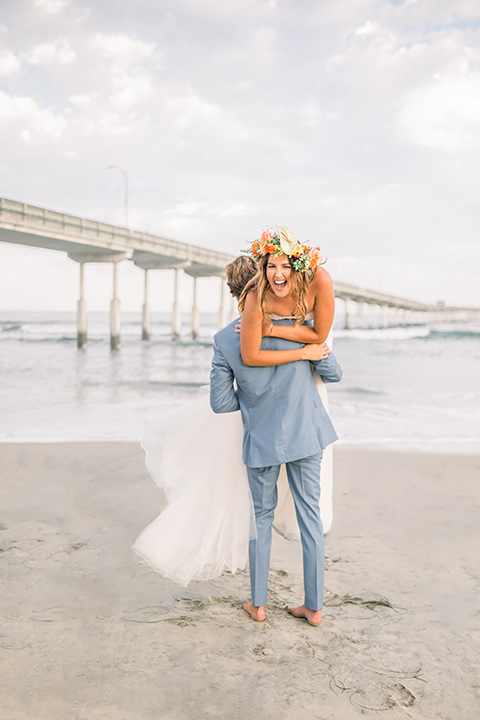  couple eloping on the beach with bright vibrant colors - couple on the beach 