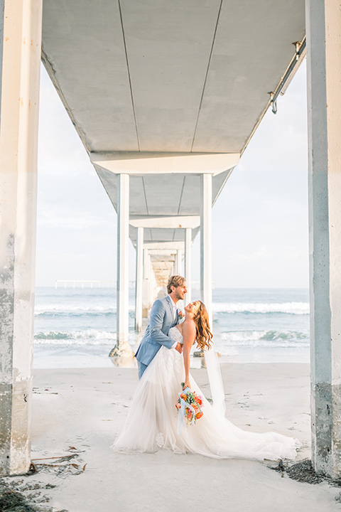  couple eloping on the beach with bright vibrant colors - couple on the beach 