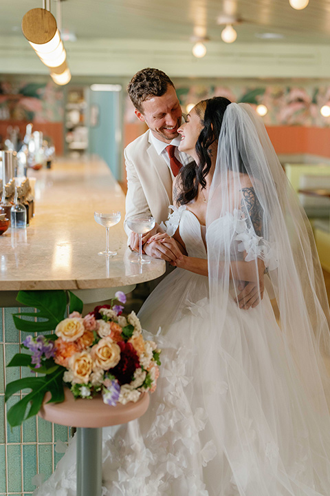  tropical and fun wedding at the Ryder Hotel – couple at the bar 