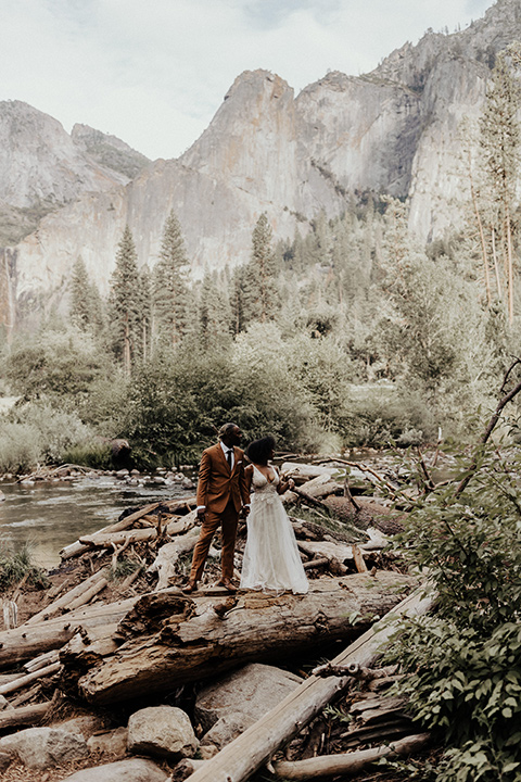  a woodland shoot in the sequoias with the groom in a caramel suit and the bride in a boho gown – woodland couple eloping 