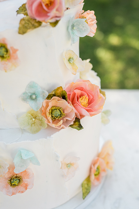  a dreamy whimsical wedding at a castle venue with the groom in a green velvet coat and the bride in a ballgown – cake 