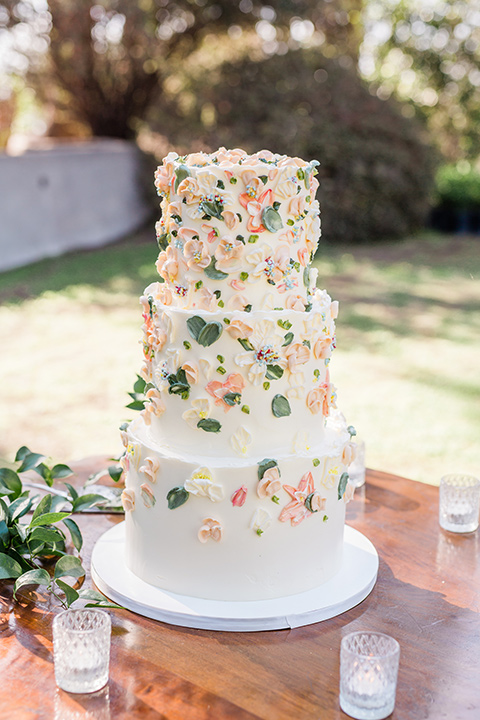  a dreamy whimsical wedding at a castle venue with the groom in a green velvet coat and the bride in a ballgown – cake 