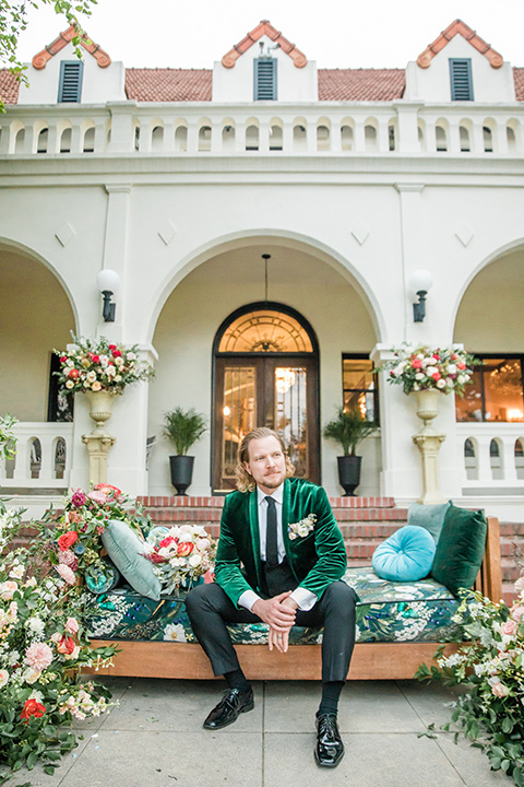  a dreamy whimsical wedding at a castle venue with the groom in a green velvet coat and the bride in a ballgown – groom 