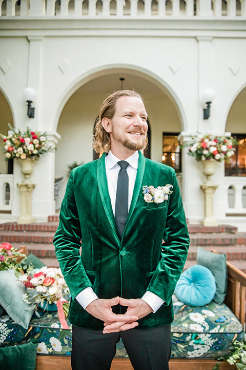  a dreamy whimsical wedding at a castle venue with the groom in a green velvet coat and the bride in a ballgown – groom 