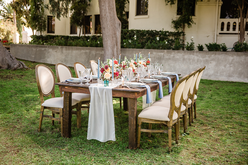  a dreamy whimsical wedding at a castle venue with the groom in a green velvet coat and the bride in a ballgown – tables 