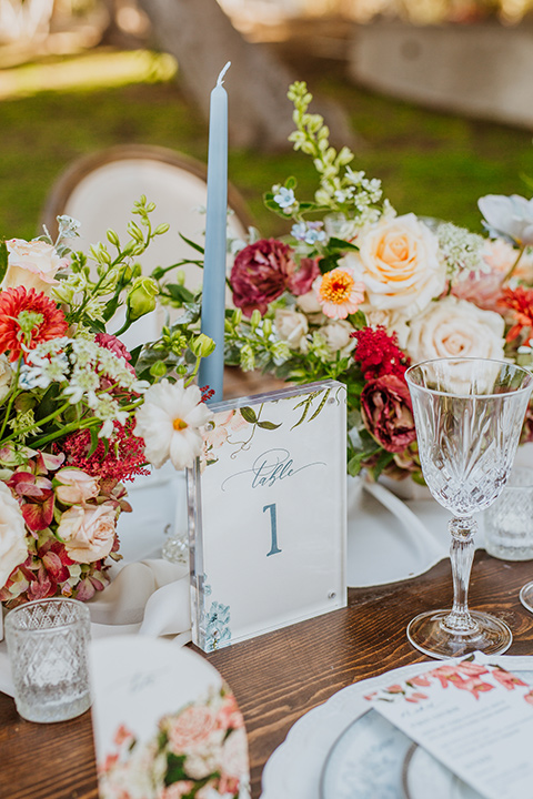  a dreamy whimsical wedding at a castle venue with the groom in a green velvet coat and the bride in a ballgown – tablescape and décor 