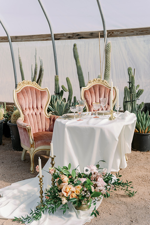 a garden romance wedding inspo with the bride in a luxe lace gown and the groom in a tan suit - table 