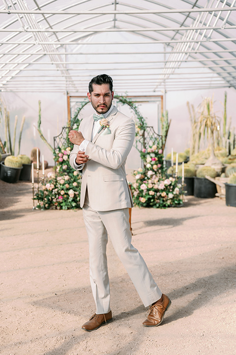  a garden romance wedding inspo with the bride in a luxe lace gown and the groom in a tan suit - groom 